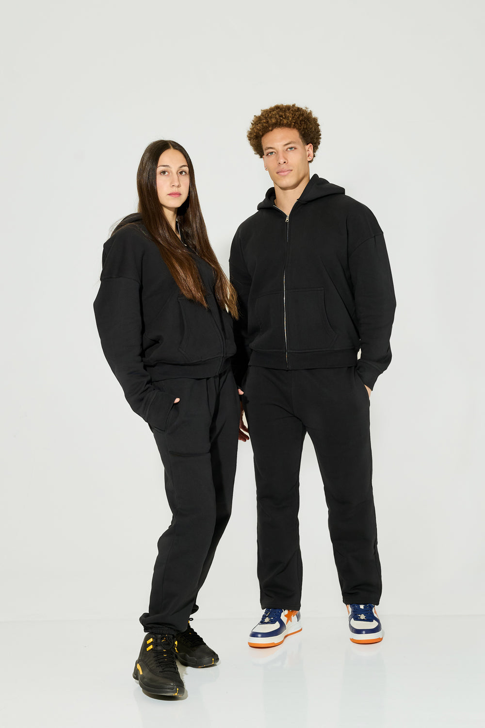 Black heavyweight hoodie and sweatpants. Made from recycled fabrics.
