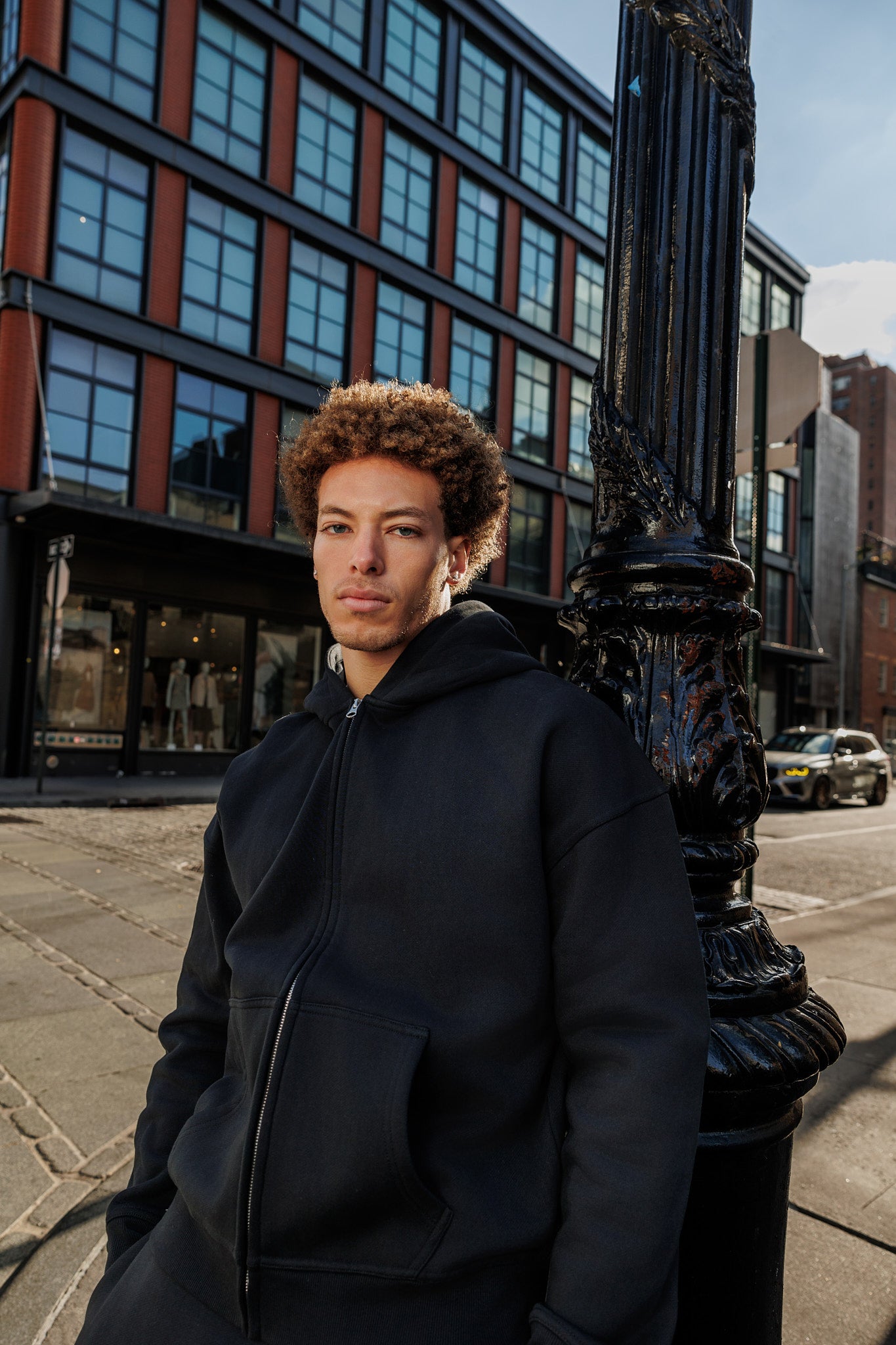 Heavyweight Black Zip Up Hoodie in Cotton. Premium and Recycled fabrics. Wholesale manufacturing.