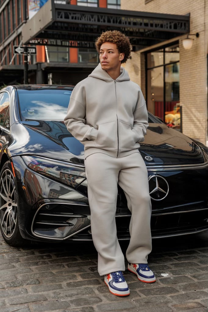 Heavyweight Cotton Polyester Zip Up Hoodie and Open Hem Sweatpants in light grey. Wholesale clothing manufacturing. 